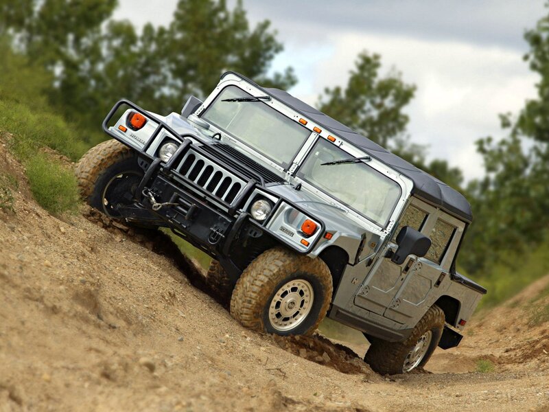 Humvee climbing a dirt hill