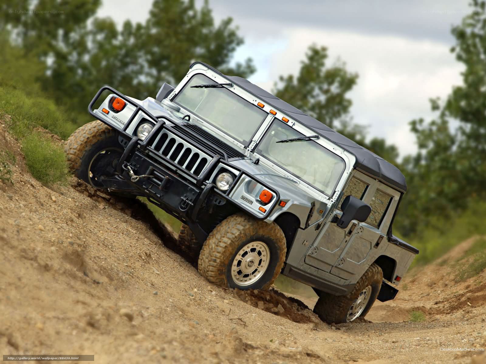Humvee climbing a dirt hill