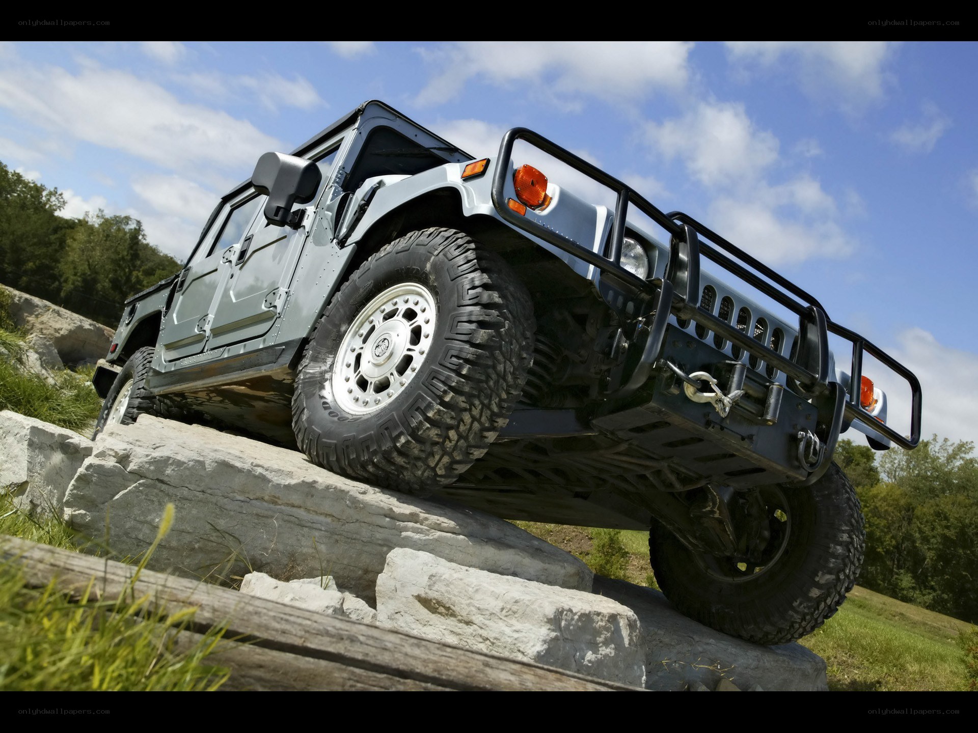 Humvee climbing rocky terrain