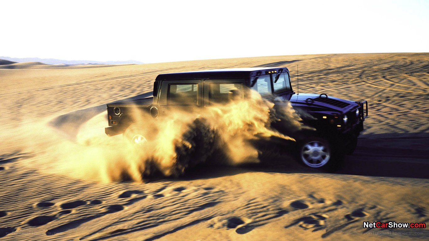 Humvee driving in desert