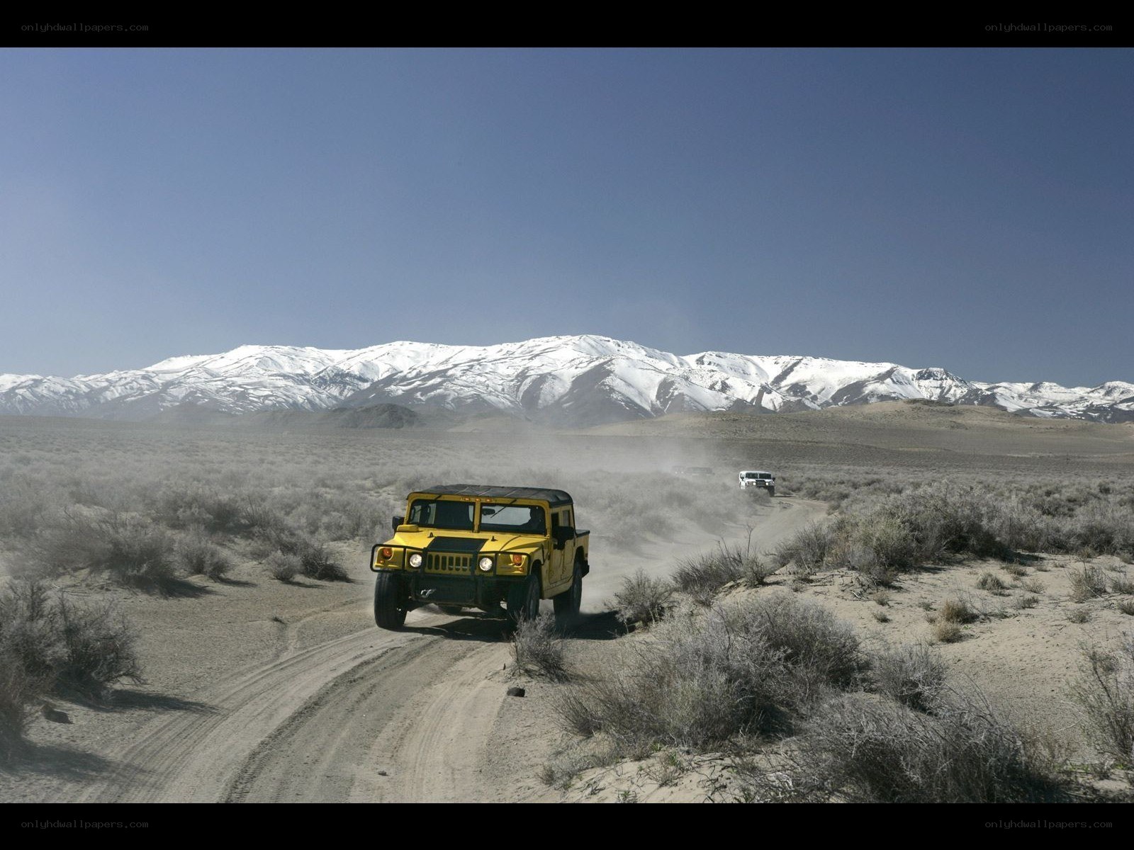 Humvee driving in desert