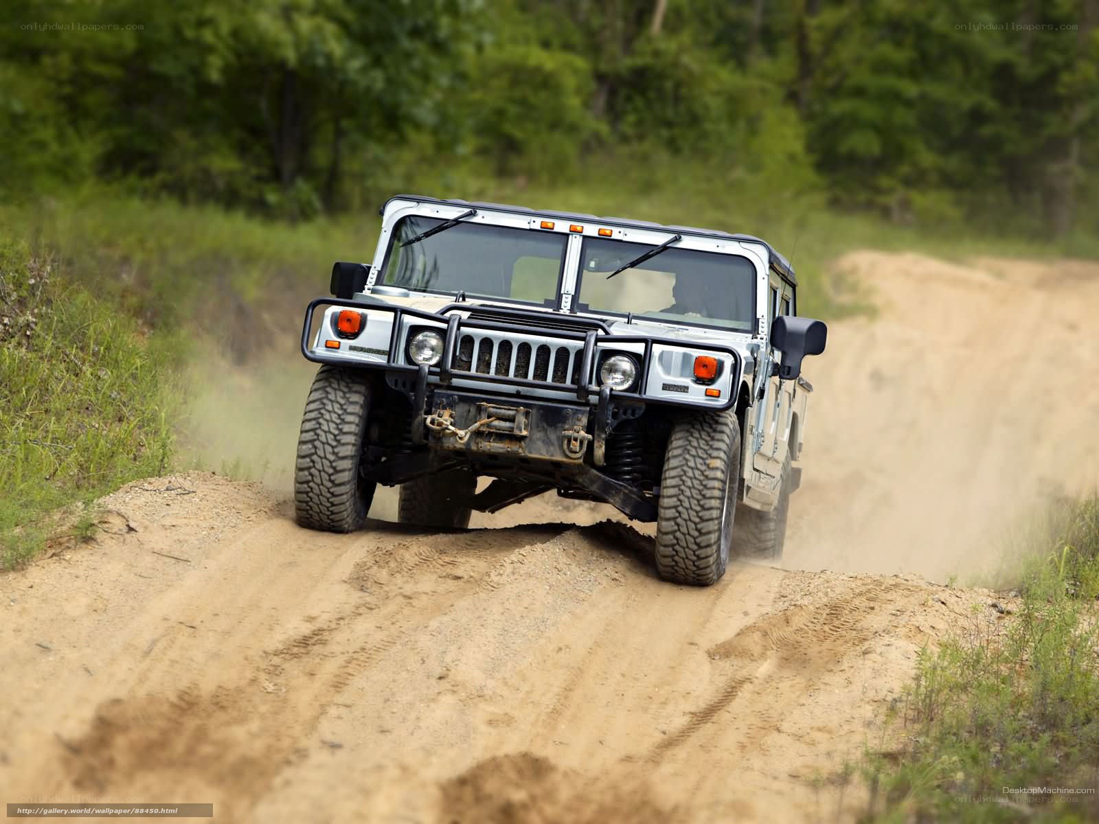 Humvee driving on dirt road