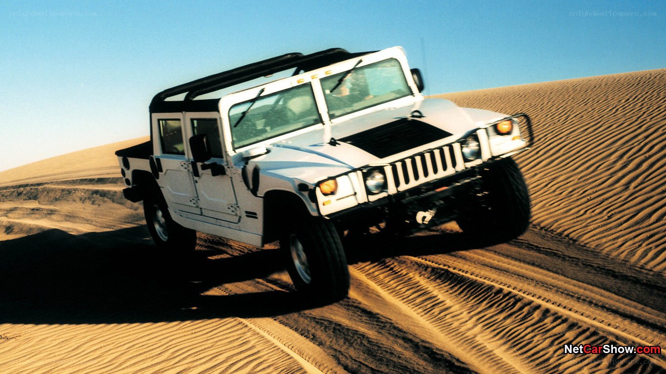 Humvee driving on sand dunes