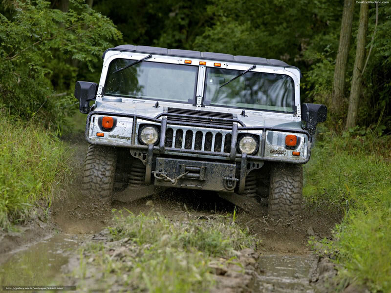 Humvee driving through mud