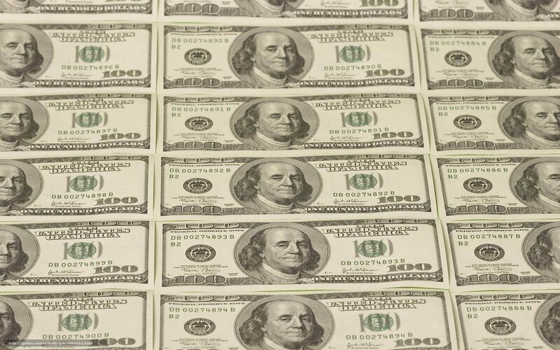 hundred-dollar bills arranged in rows
