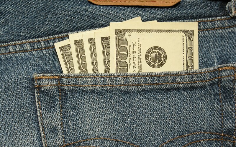 hundred-dollar bills in jeans pocket