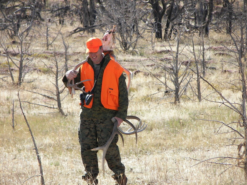 Hunter Carrying Deer Antlers