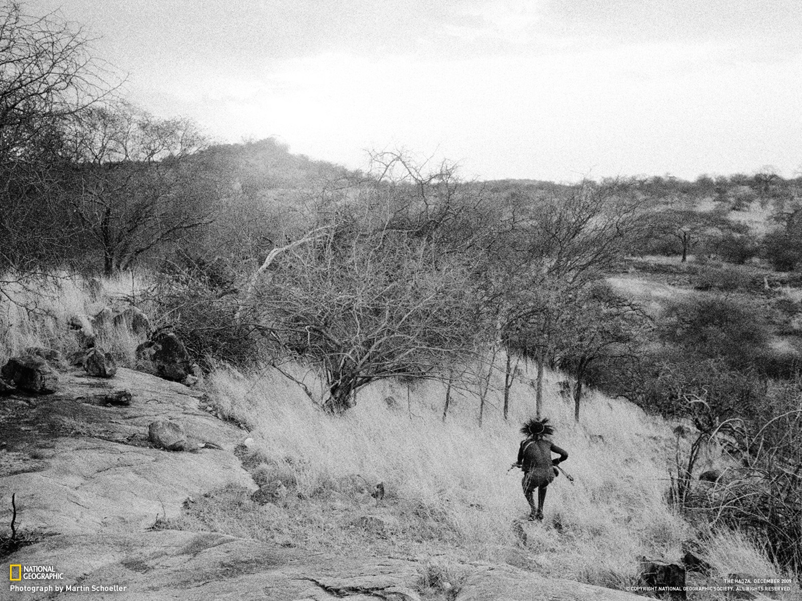 Hunter in African landscape
