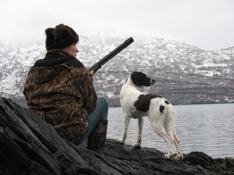 Hunter with Dog on Shore