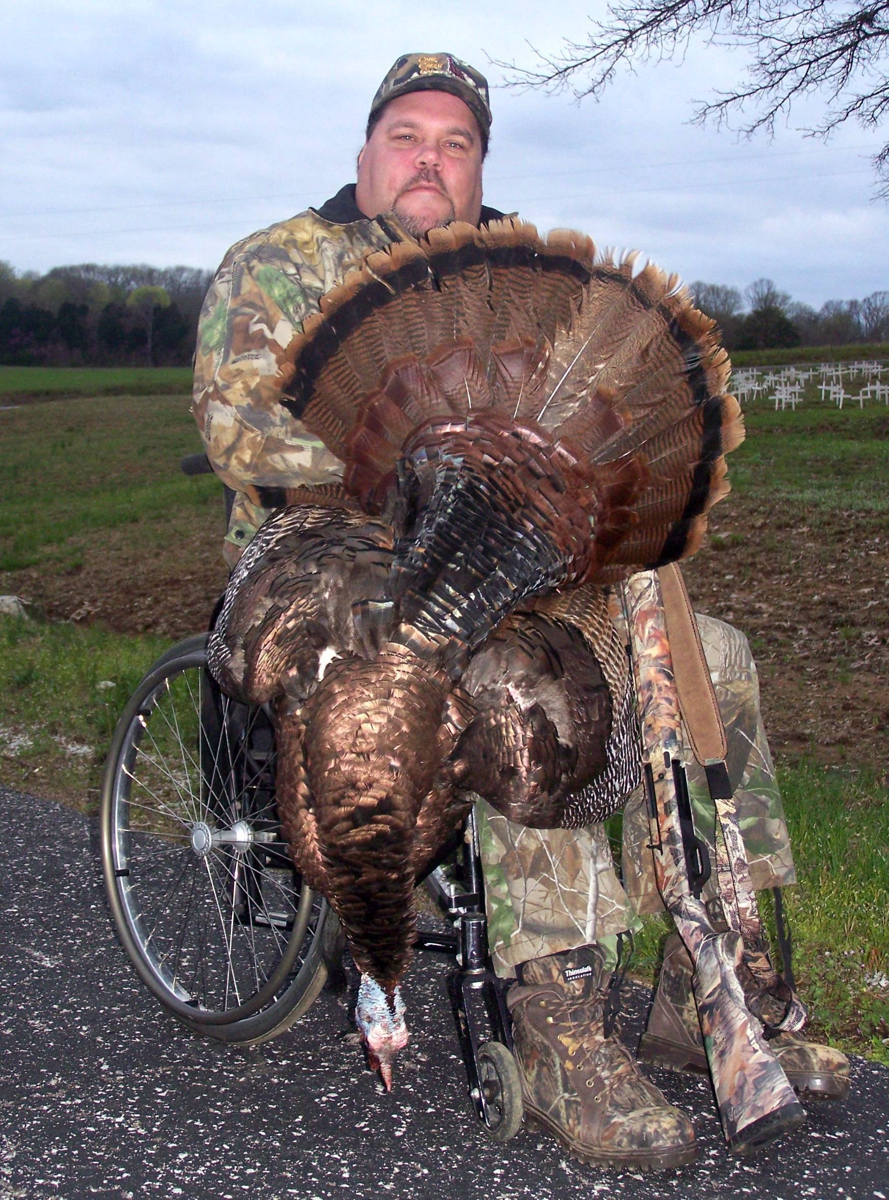 Hunter with harvested turkey