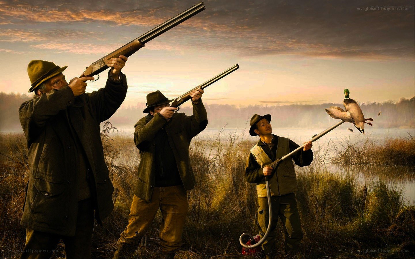 Hunters with shotguns at sunset