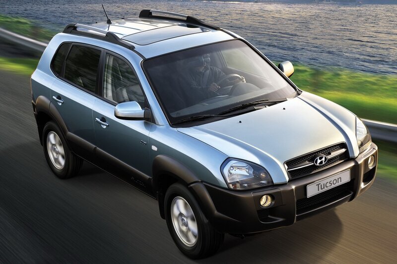 Hyundai Tucson driving on coastal road
