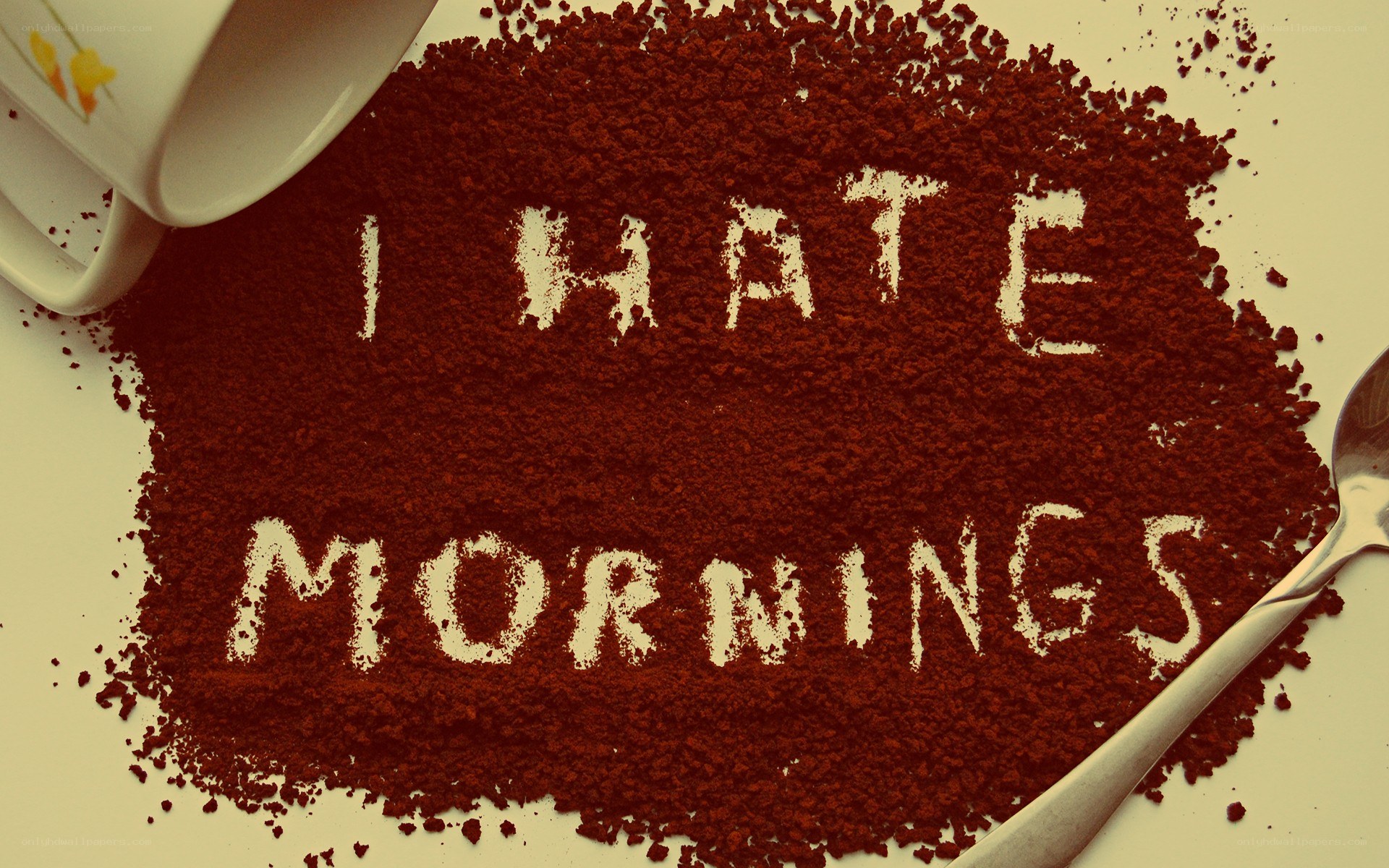 I hate mornings text on coffee grounds