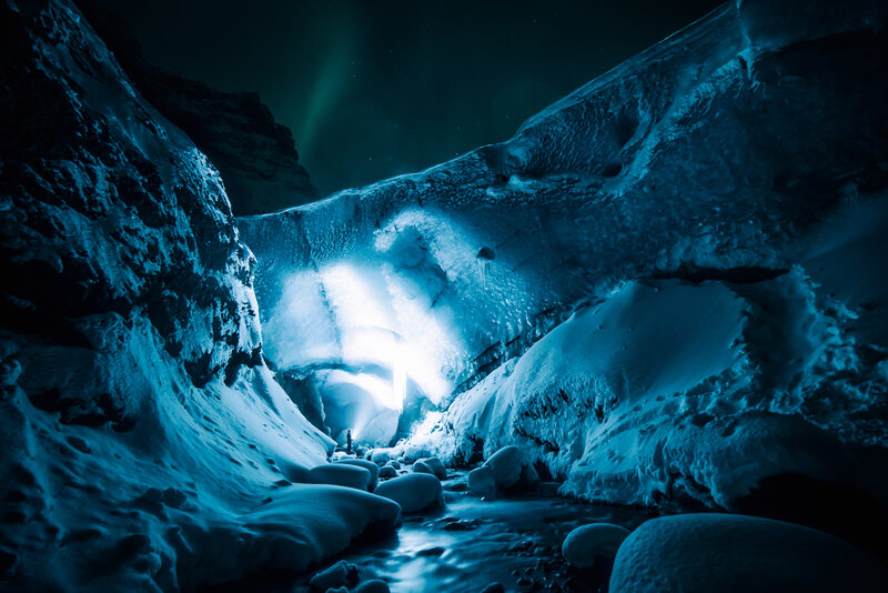 Ice cave under northern lights