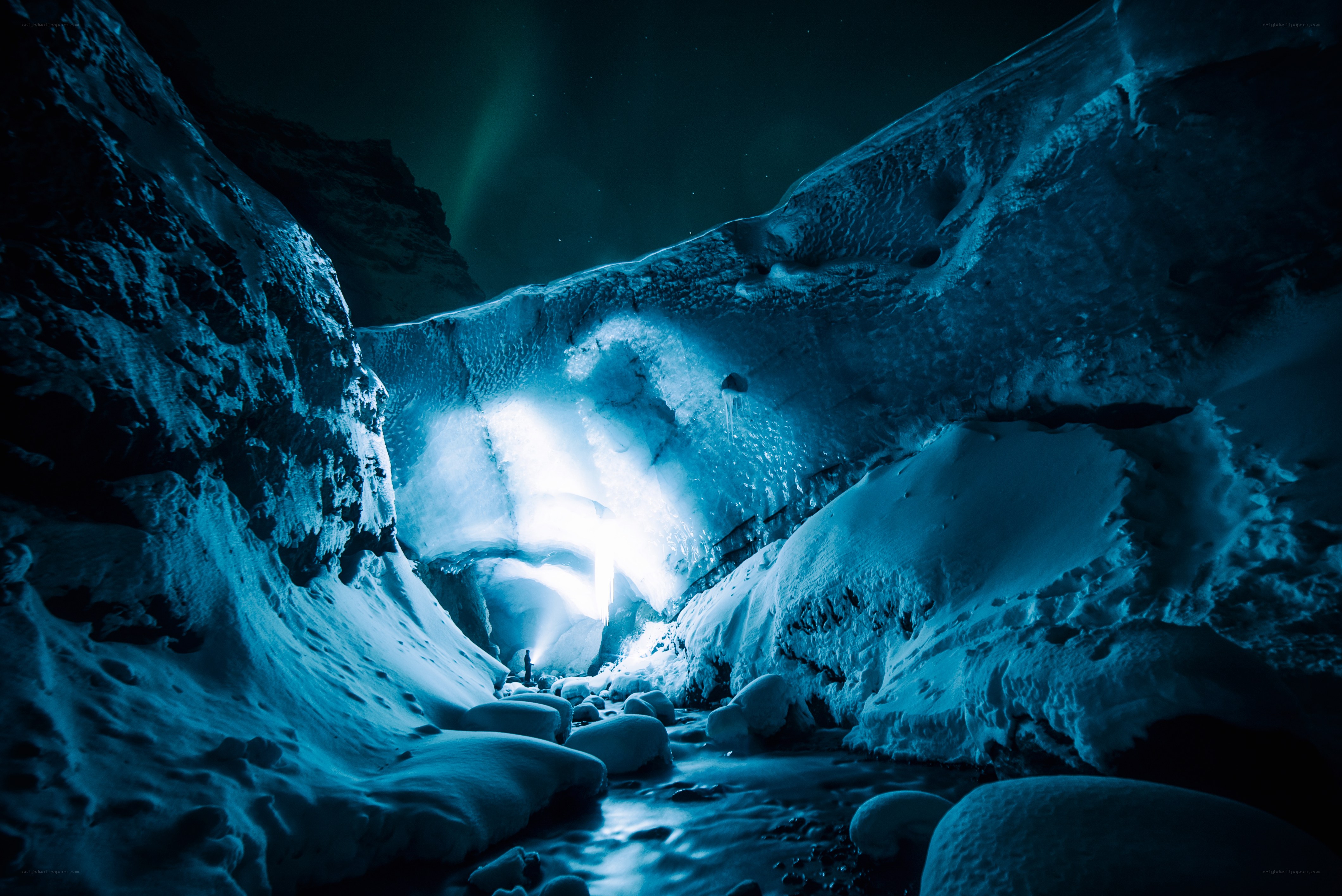 Ice cave under northern lights