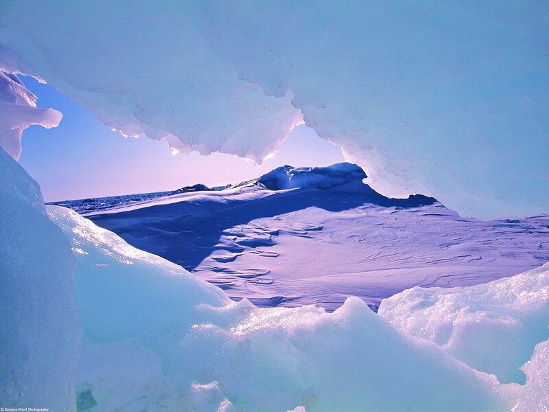 ice cave view of snowy landscape