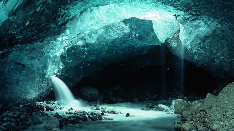 Ice cave with waterfall