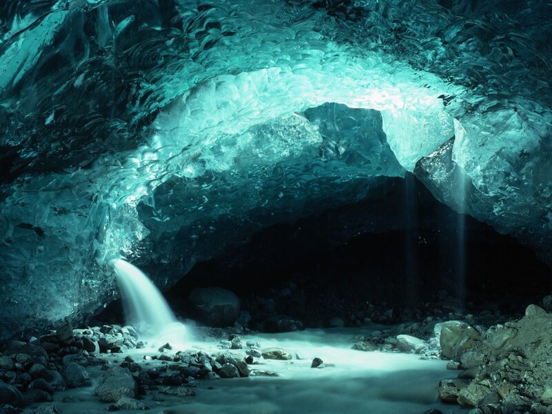 Ice cave with waterfall