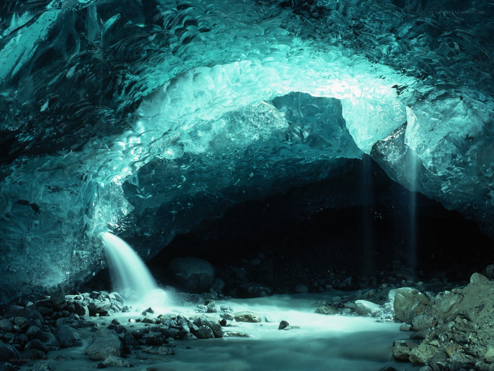 Ice cave with waterfall