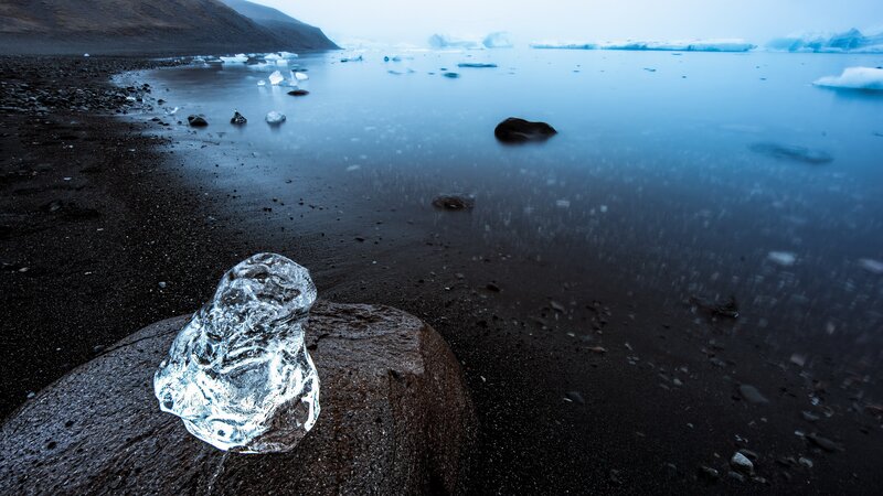 Ice Chunk on Black Sand — Blue, Serene, Winter
