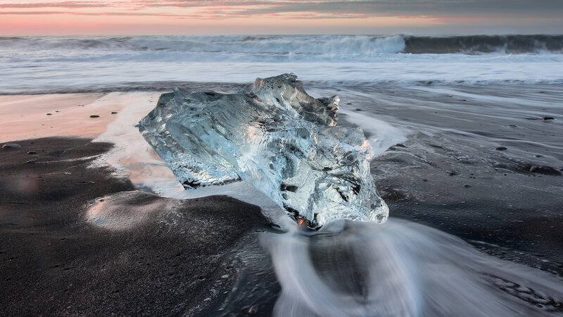 Ice Chunk on Black Sand — Serene