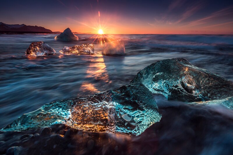 Ice Chunks on Beach — Blue, Dramatic, Sunset, Photograph, Sun