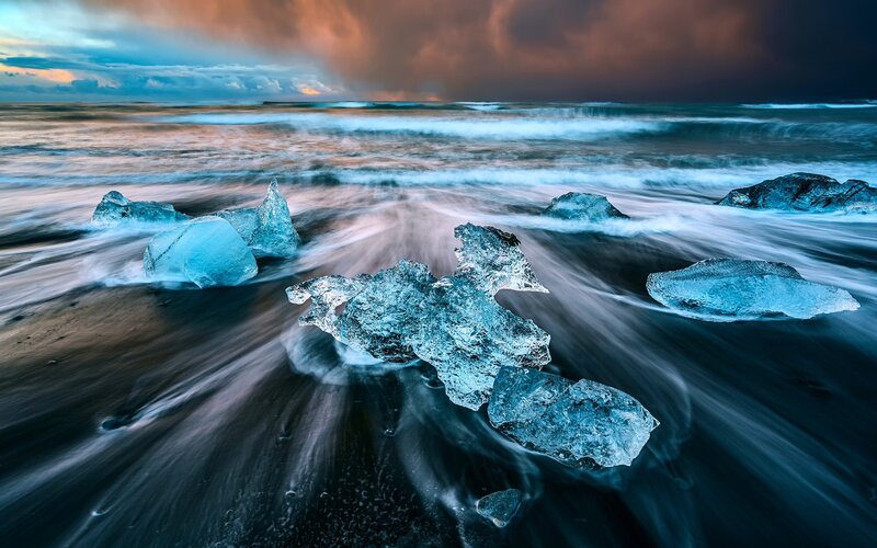 Ice Chunks on Black Sand — Blue, Dramatic, Sunset, Photograph