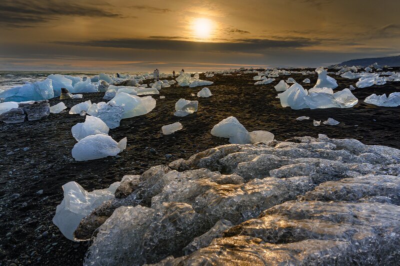 Ice Chunks on Black Sand — Dramatic, Sunset, Photograph