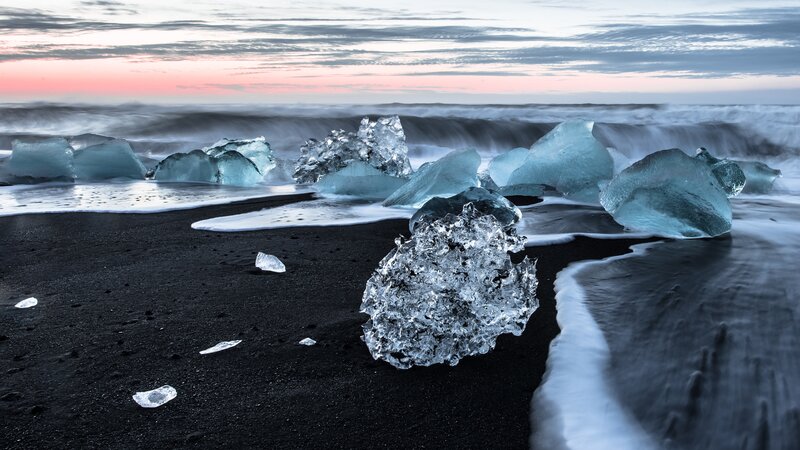 Ice Chunks on Black Sand — Serene, Sunset
