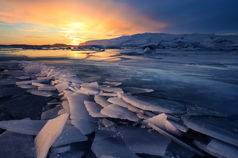 Ice Chunks on Frozen Lake — Orange, Serene