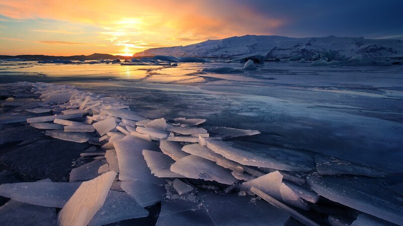 Ice Chunks on Frozen Lake — Orange