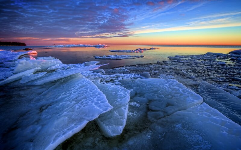Ice Chunks on Shore — Blue, Dramatic, Sunrise