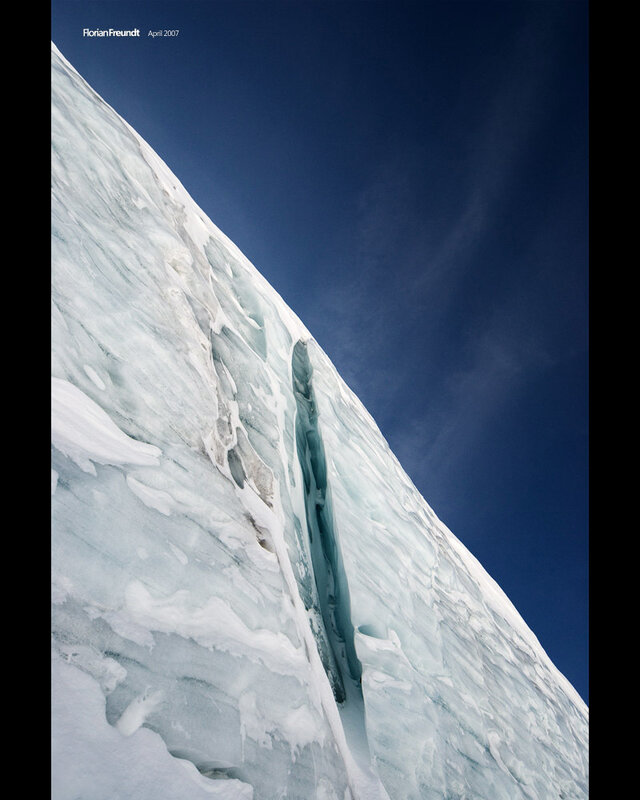 Ice cliff under blue sky