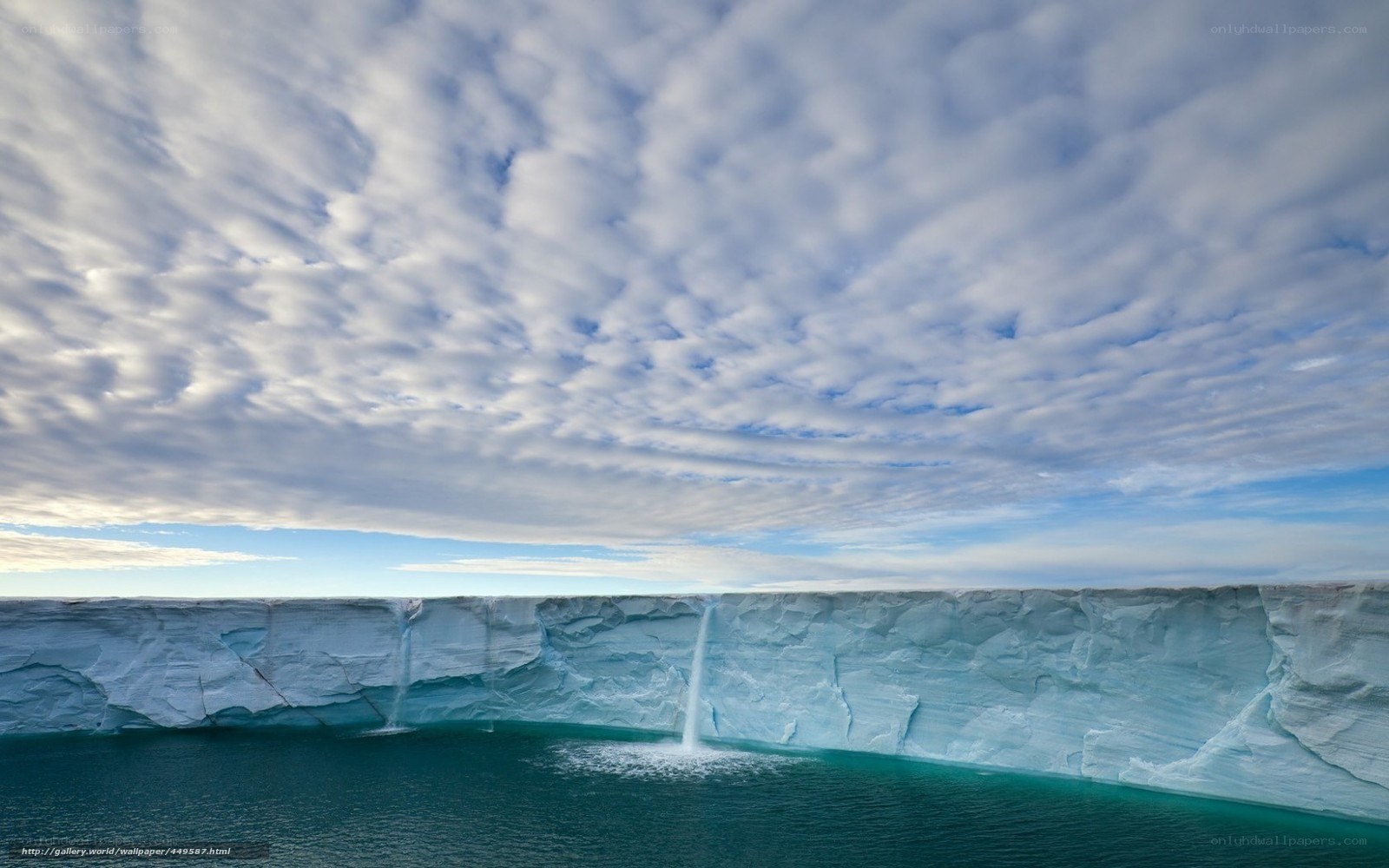 Ice cliff with waterfalls