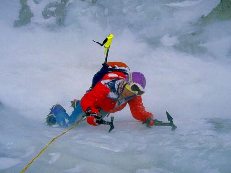 Ice climber on a frozen waterfall