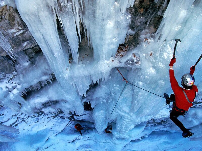 Ice Climber on Frozen Waterfall — Blue