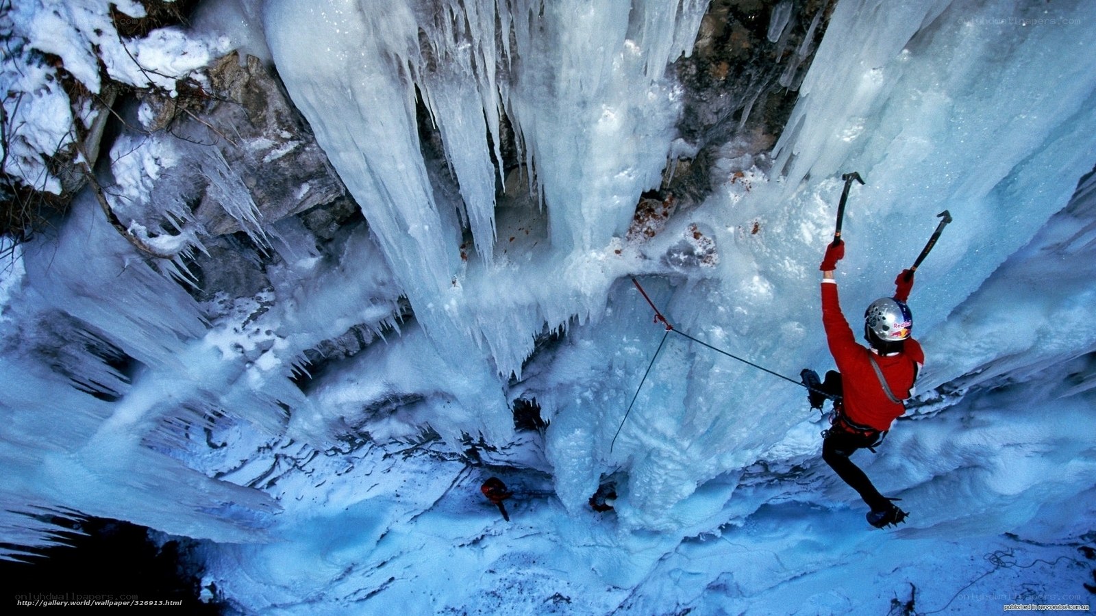 Ice climber scaling frozen waterfall
