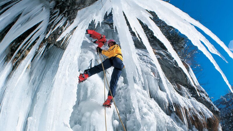 Ice Climbers on a Frozen Waterfall — White, Dramatic