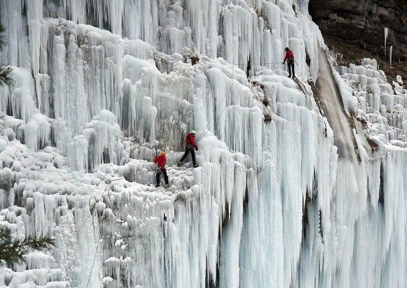 Ice climbers on frozen waterfall
