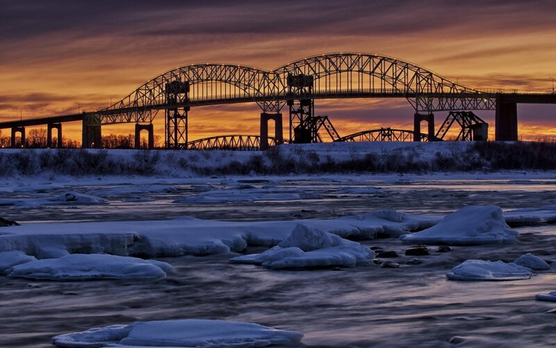 Ice-covered River at Sunset — Orange