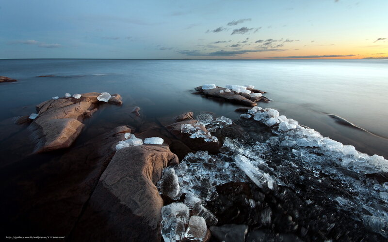 Ice-covered rocks at sunset