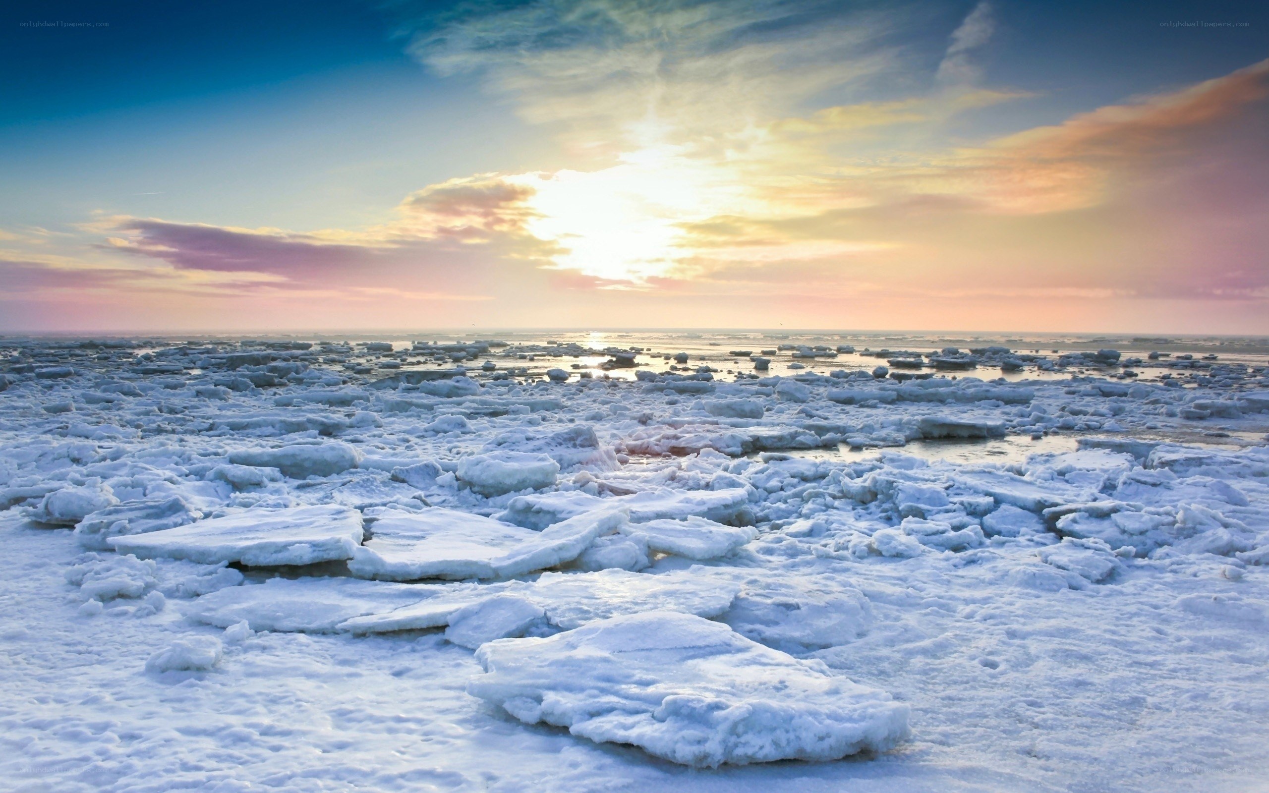 ice-covered sea at sunset