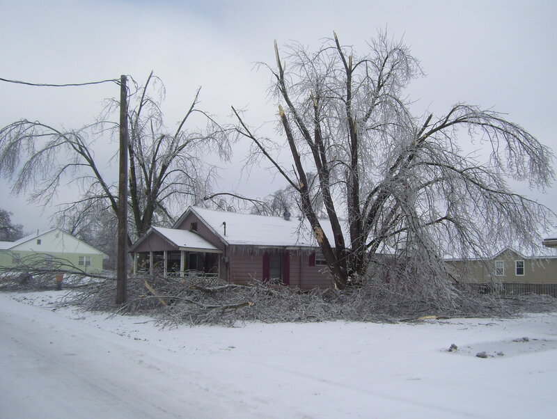 Ice-covered trees damage house