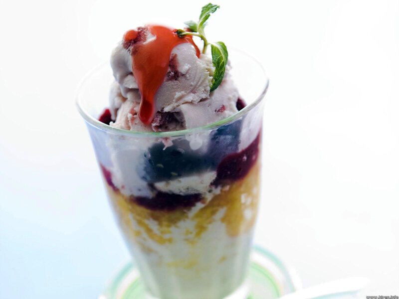 ice cream sundae with berry sauce