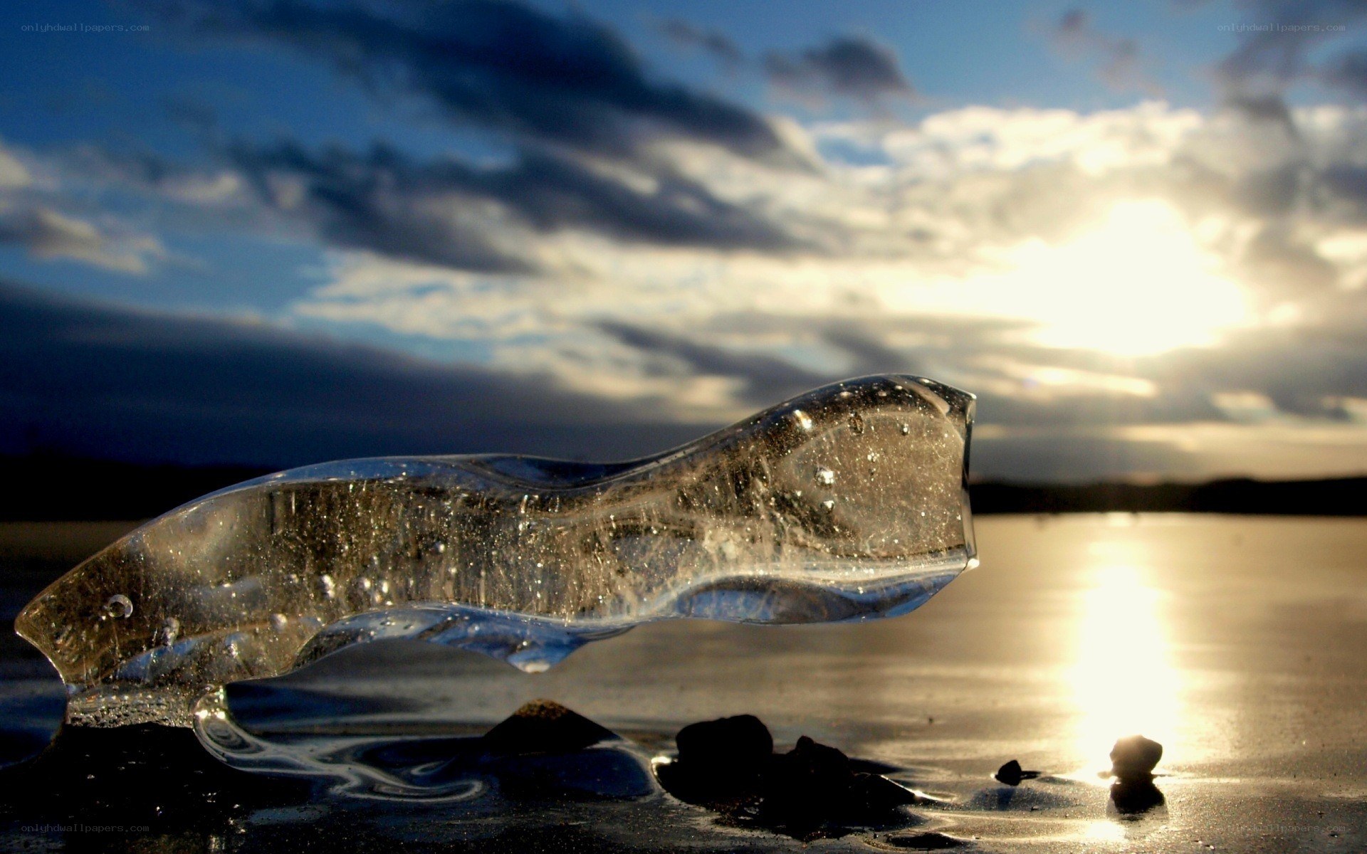 ice sculpture on beach at sunset