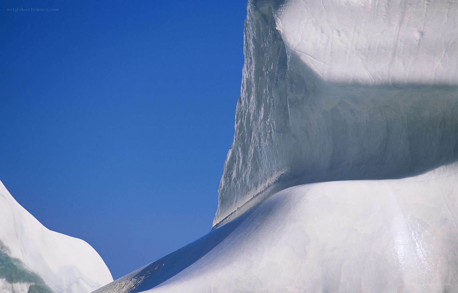 Iceberg against blue sky