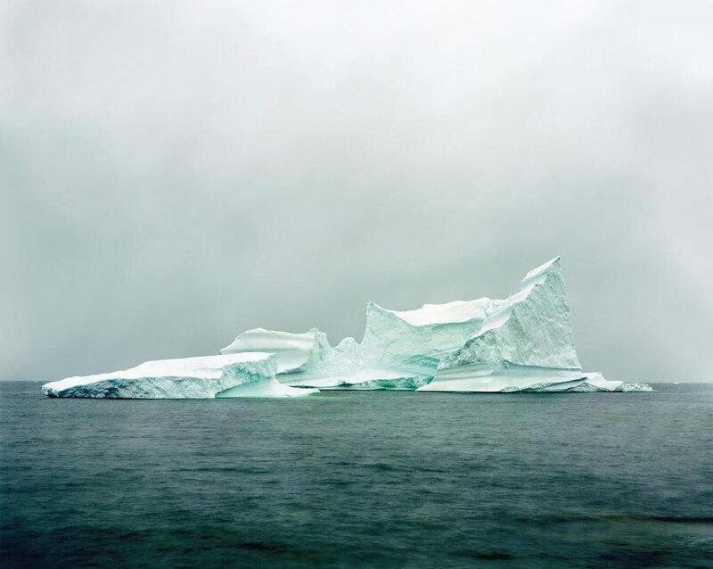 Iceberg floating in calm sea