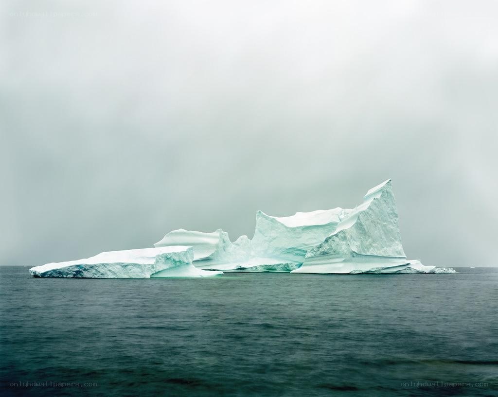 Iceberg floating in calm sea