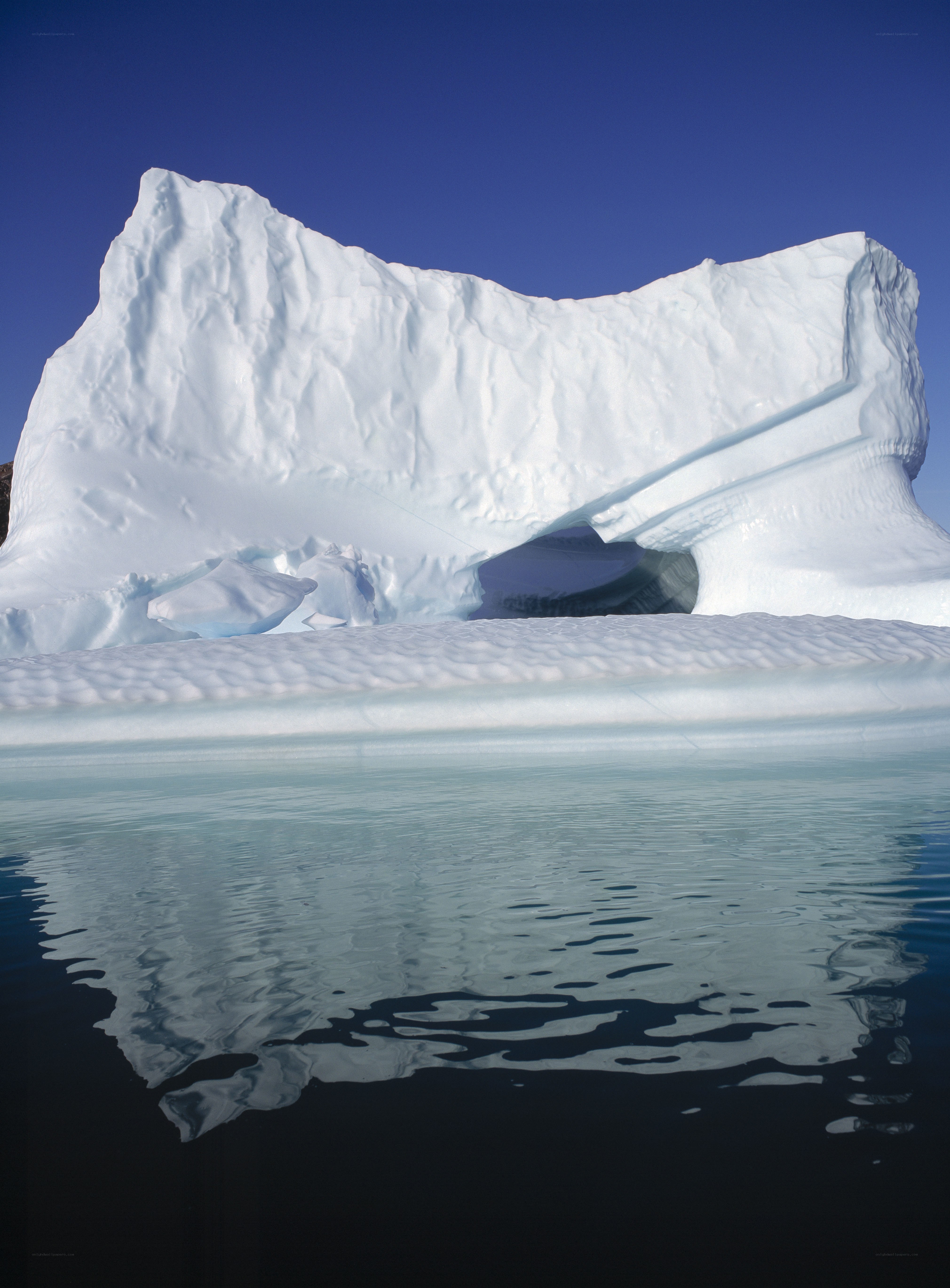 Iceberg floating in calm water