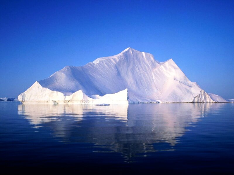 Iceberg floating in calm water